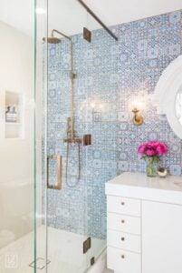 These blue tiles do an AMAZING job at making this bathroom work. It adds a pop of color to keep everything from being to white and plain.