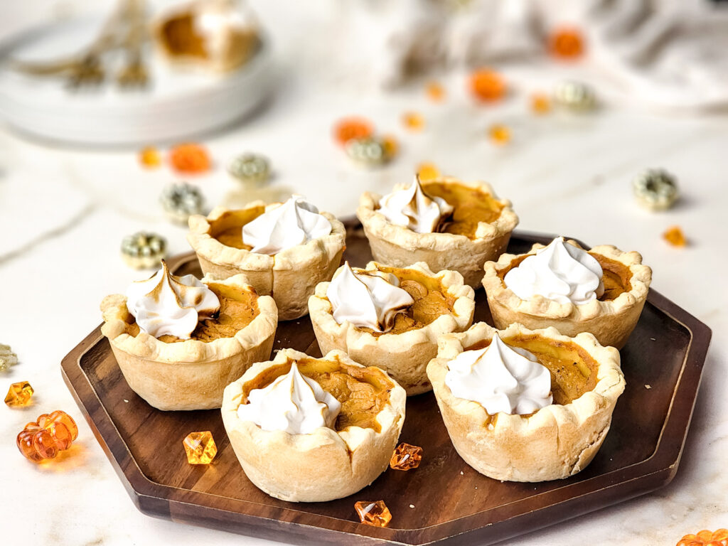 Mini Pumpkin Pies are the perfect bite-sized treat! With a flaky pie crust, creamy spiced pumpkin filling, and a fluffy meringue topping, these adorable desserts are sure to impress any crowd.

