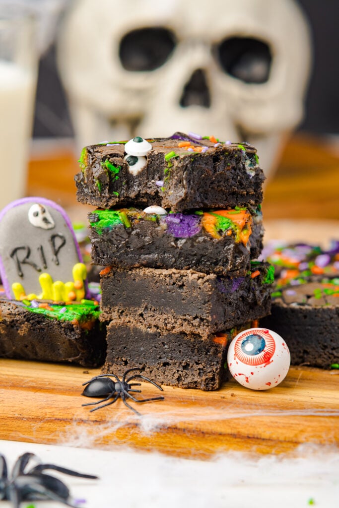 Halloween Cream Cheese Swirl Brownies | These brownies are simple to put together but make a big impression with their colorful cream cheese swirls and deep chocolate flavor. Using real dark chocolate and a touch of cocoa gives them a fudgy texture, while the cream cheese adds a creamy contrast in every bite.