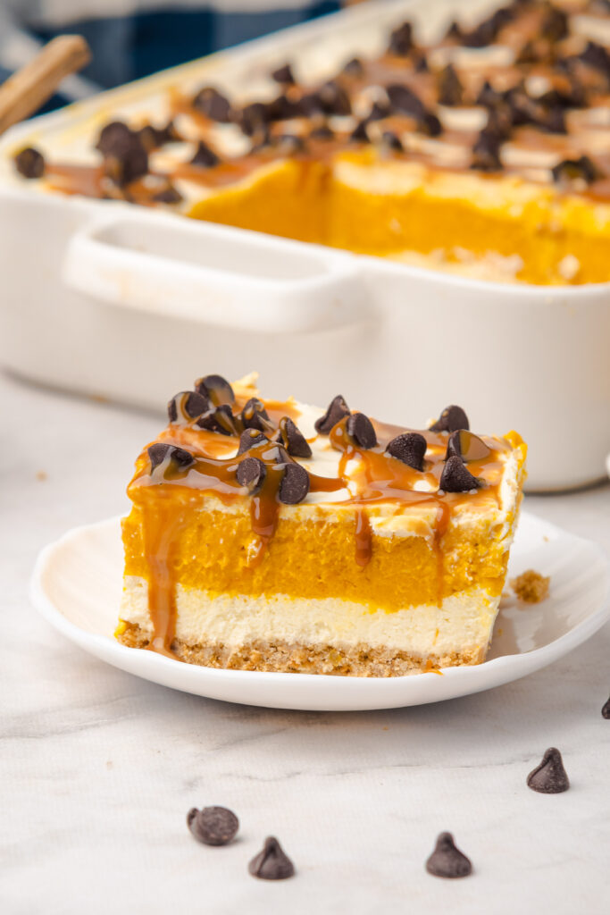 Pumpkin Lush | Pumpkin Desserts | When the air turns crisp and pumpkin spice is everywhere, I can’t resist making a dessert that truly captures the flavors of fall. Enter this dreamy Pumpkin Lush—a no-bake, layered treat that’s as easy to make as it is to devour! Imagine a buttery graham cracker crust, a creamy cheesecake layer, and a luscious pumpkin pudding filling, all topped with fluffy whipped cream.