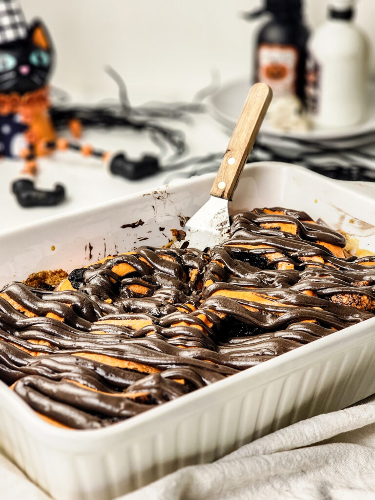 Soft cinnamon rolls with Oreo filling and black cocoa frosting, a spooky-sweet Halloween magic in every cozy bite.