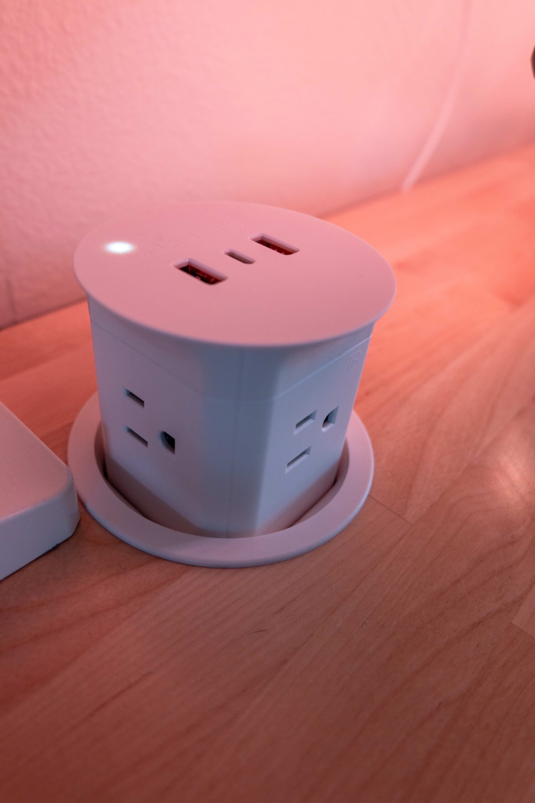 Gift Guide for People Who Practically Live at Their Desk: UPLIFT Accessories Review, featuring Engage Stool, Pop-up Power Grommet, Hook and Loop Wire Wraps, and the 3-Drawer Narrow Square File Cabinet.